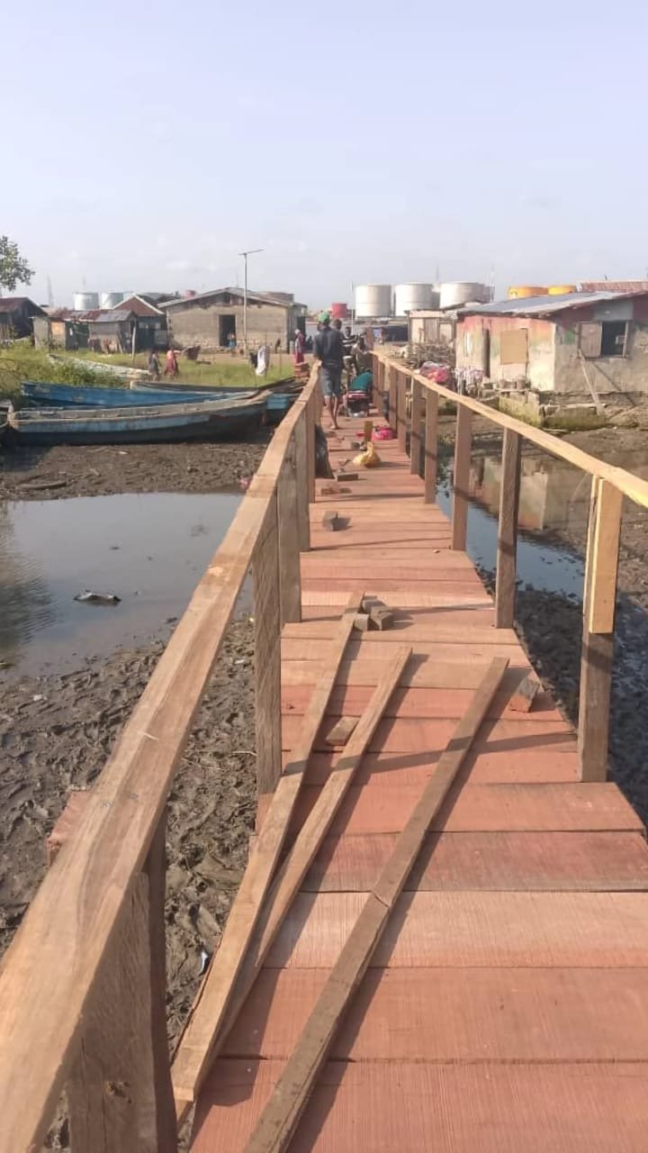 The bridge during construction with handrails and loose timber on the deck